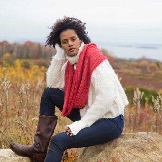 Swans Island Company's Coastal Cowl. Soft and silky, hand-dyed merino wool silk. This luxurious infinity loop is designed in Maine and knit in USA with hand-dyed yarns. Shown here in Currant red.