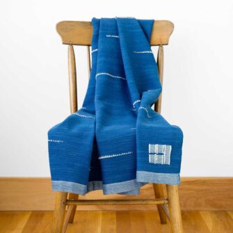 Swans Island Whitecaps Throw - Handwoven in Maine with hand-dyed organic merino wool. Indigo with Natural.