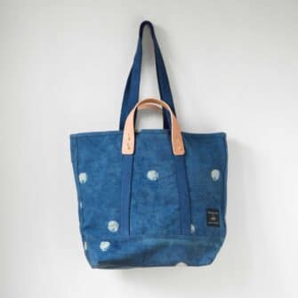 Swans Island Company's Small East West Canvas Tote by Immodest Cotton. Sturdy canvas tote with detachable leather handles. Shown here in Light Indigo Moon color.