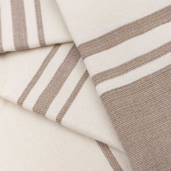 Casa Branca x Swans Island - Branca Grande Throw . 100% soft merino wool with hand-dyed stripes and ivory silk binding. Handwoven in Maine. Shown here in Biscotti.