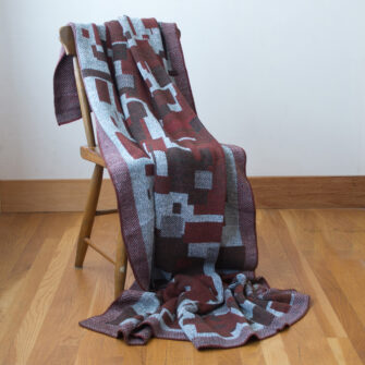 Upcycled Artisanal Patchwork Throw #22- an artisanal knt throw. Made in USA with reclaimed cotton and other blended yarns. Each one is unique,