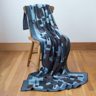 Upcycled Artisanal Patchwork Throw #24- an artisanal knt throw. Made in USA with reclaimed cotton and other blended yarns. Each one is unique,