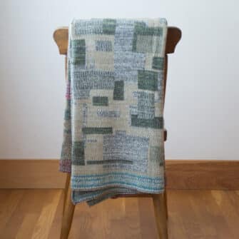 Upcycled Artisanal Patchwork Throw #21- an artisanal knt throw. Made in USA with reclaimed cotton and other blended yarns. Each one is unique,