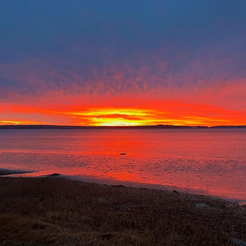 Swans Island Company's Horizon Limited Edition 2026 Throw was inspired by the vibrant colors of sunrise and sunset. A fiery orange water and horizon line as the sun risees along the Maine coast.