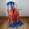 Swans Island Company's Horizon Limited Edition 2026 Throw - A tangible homage to the vibrant colors of first light and golden hour when the sun rises and sets. Handwoven in Maine with hand-dyed wools - a textiles collectors piece.