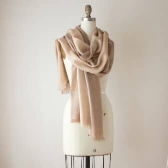 Swans Island Company's Gossamer Alpaca Shawl in camel color on mannequin