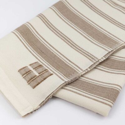 White throw with brown stripes